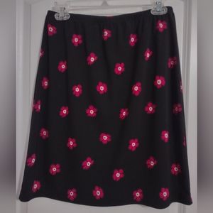 Lovely black skirt with red flowers.